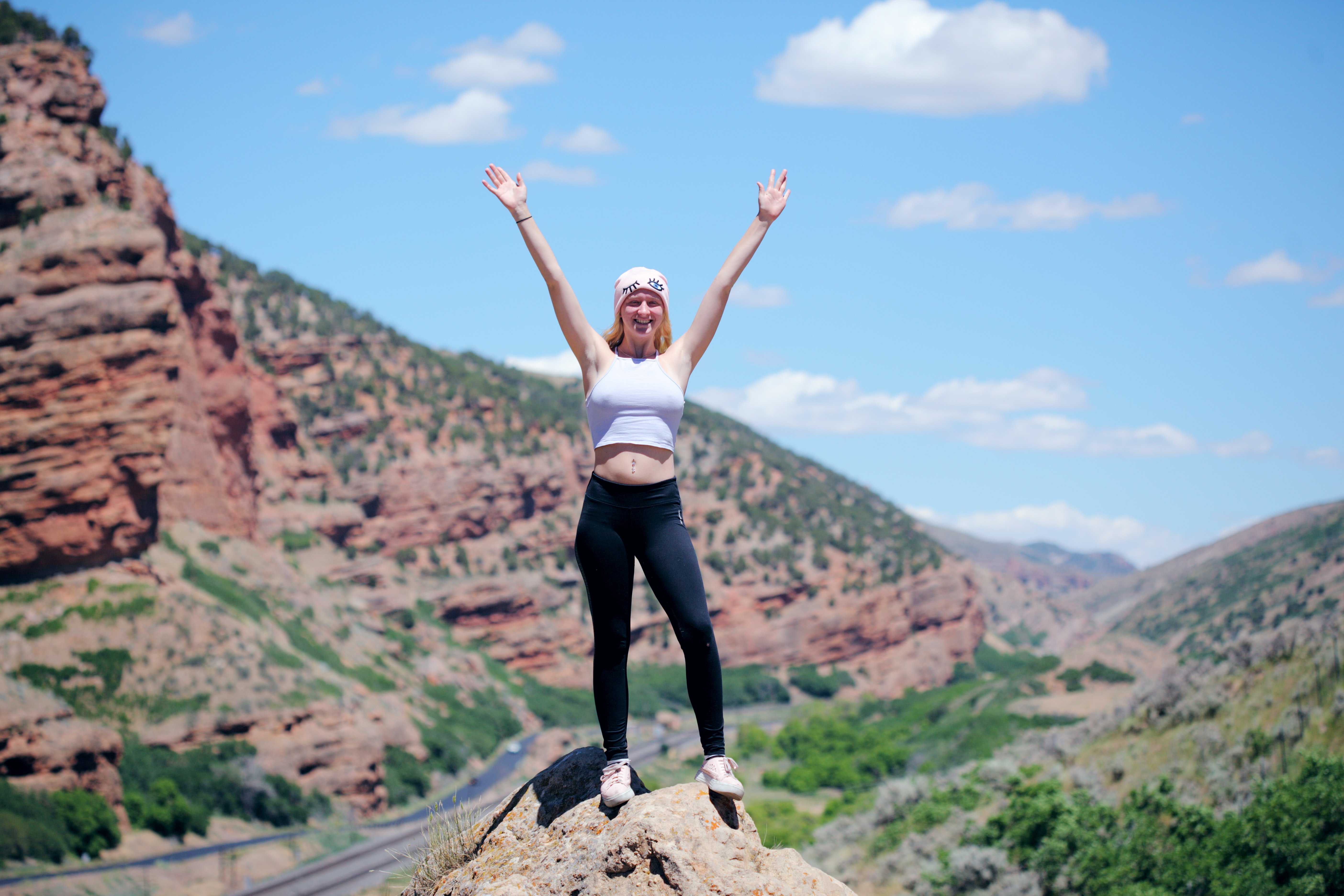 Marketing Goals / Marketing plan article stock photo from sharon-mccutcheon serial n5oAiYrQ0JY via unsplash. Depicts a woman standing on a mountain peak.